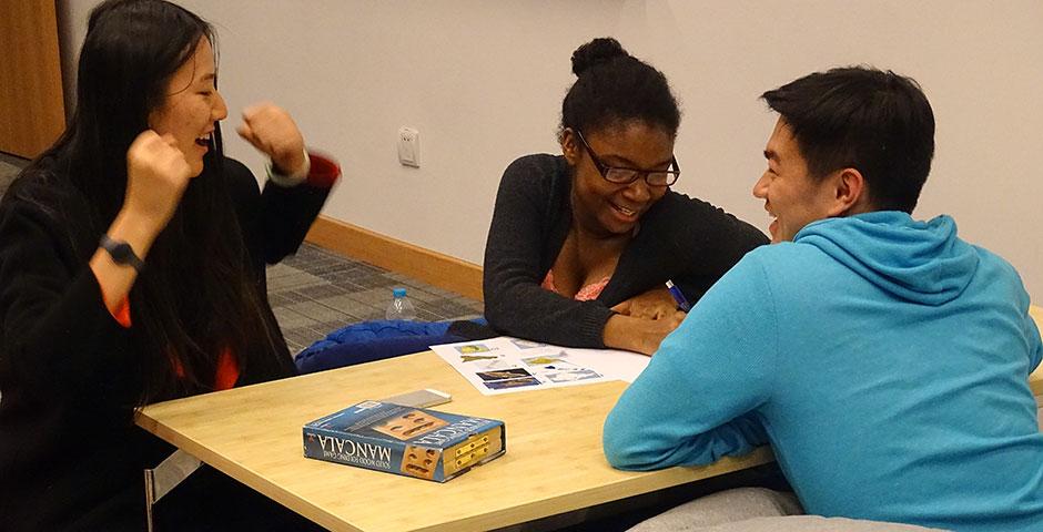 NYU Shanghai and NYU Abu Dhabi students battled each other in the first-ever Game Off competition, featuring Pictionary, charades, trivia contests, and board games. April 16, 2015. (Photo by Danni Wang)