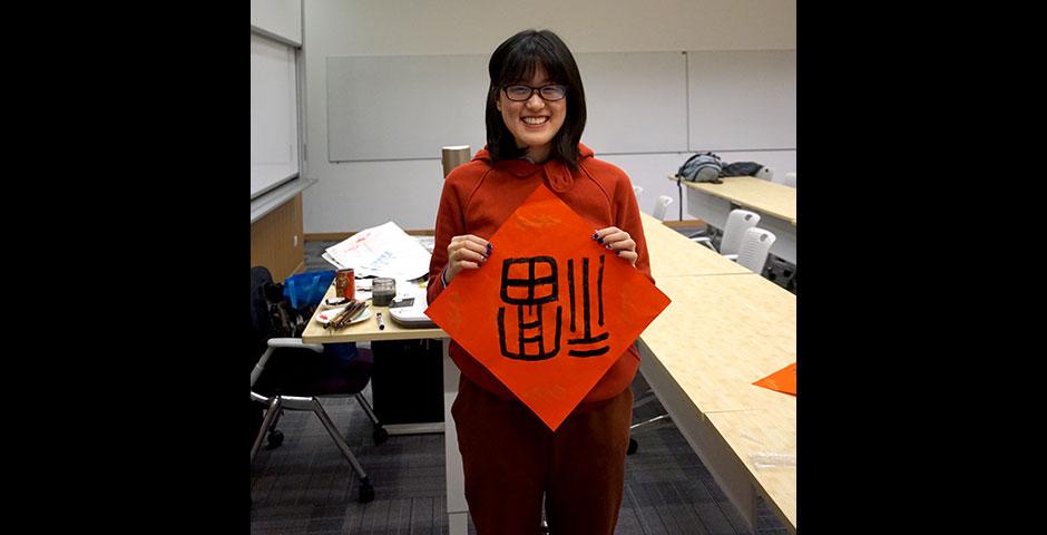 Students prepare for the Year of the Sheep with Chinese New Year writings. February 13, 2015. (Photo by Mei Wu)