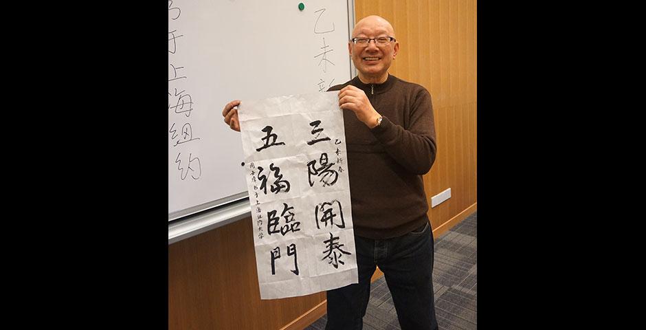 Students prepare for the Year of the Sheep with Chinese New Year writings. February 13, 2015. (Photo by Mei Wu)