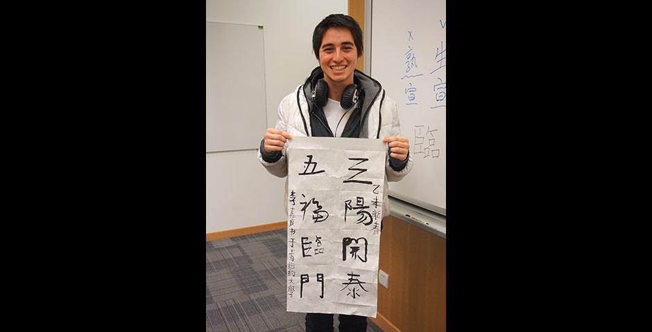 Students prepare for the Year of the Sheep with Chinese New Year writings. February 13, 2015. (Photo by Mei Wu)