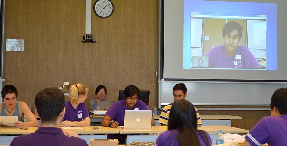 To prepare themselves for video calls with the incoming Class of 2019, Orientation Ambassadors act out a mock Skype session. April 25, 2015. (Photo by Shelly Lu &amp; Joyce Tan)