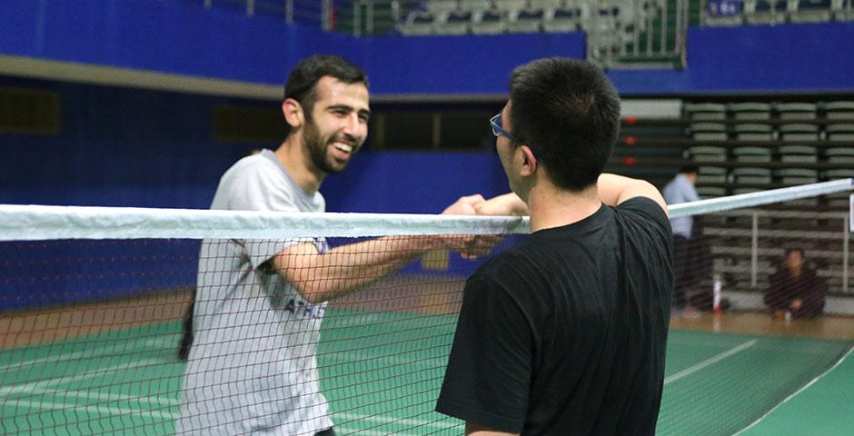 Students compete in the final round of the Intramural Badminton Tournament at Yuanshen Sports Centre Stadium. March 12, 2015. (Photo by Kevin Pham)