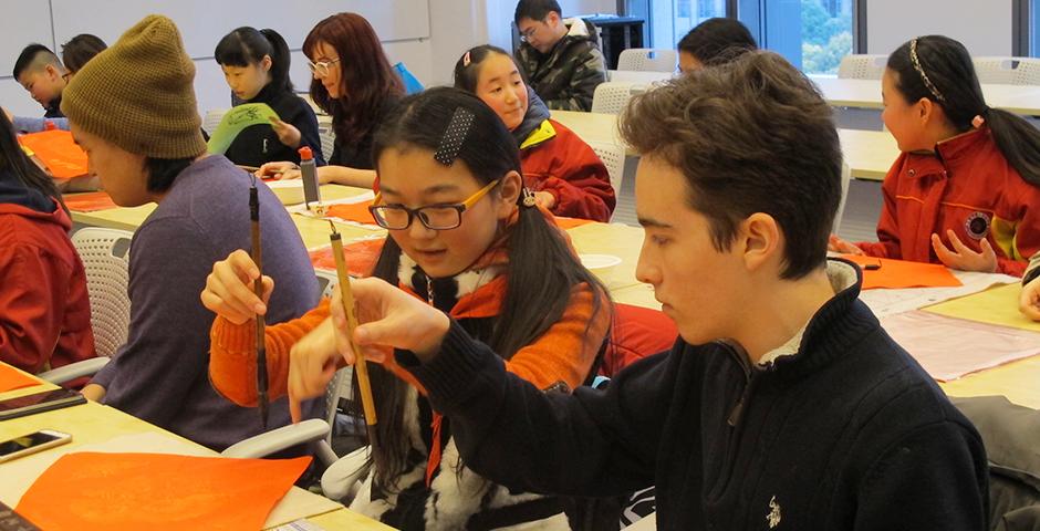 Student activities marking the celebration of Chinese New Year included paper-cutting craft workshops, games and scroll painting. (Photo by: NYU Shanghai)