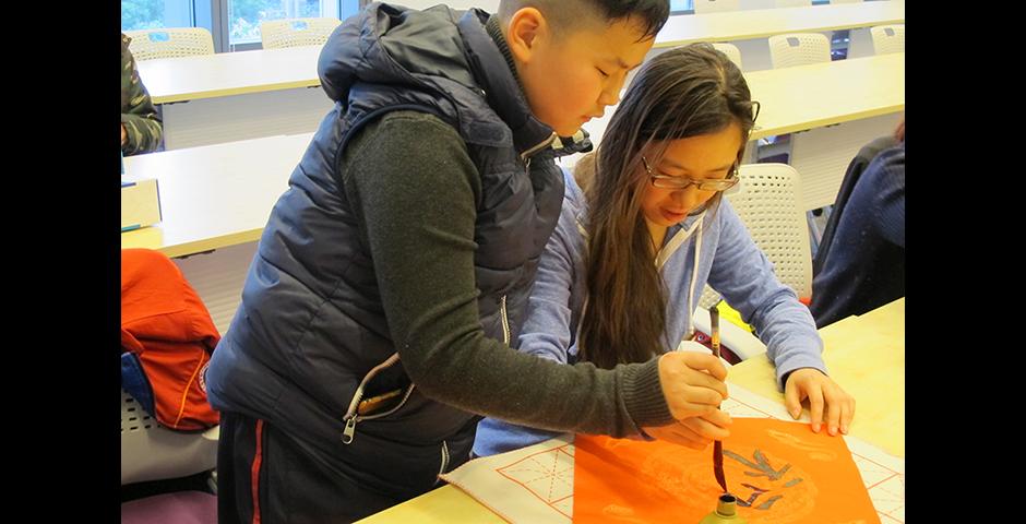 Student activities marking the celebration of Chinese New Year included paper-cutting craft workshops, games and scroll painting. (Photo by: NYU Shanghai)