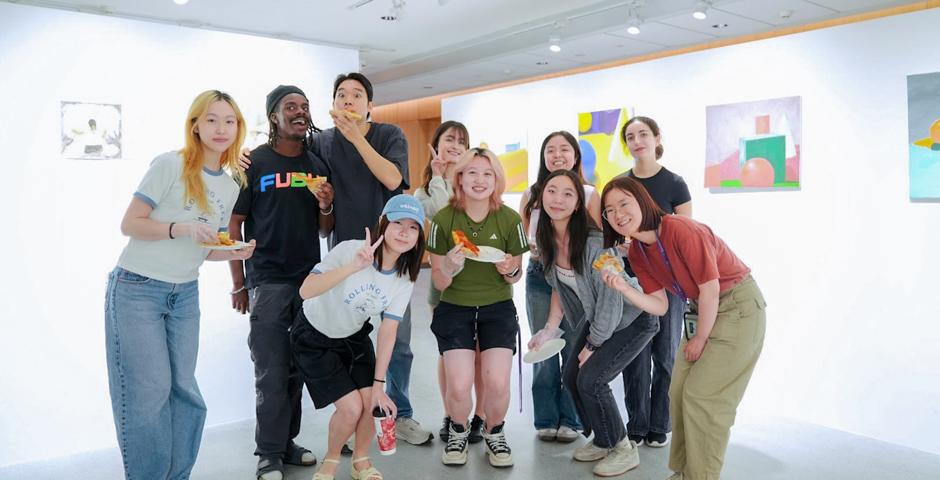 Students from theFoundations in Painting course taught by Assistant Arts Professor of Visual Arts Maya Kramer pose together at their final exhibition, “The Products of Non-Art.”