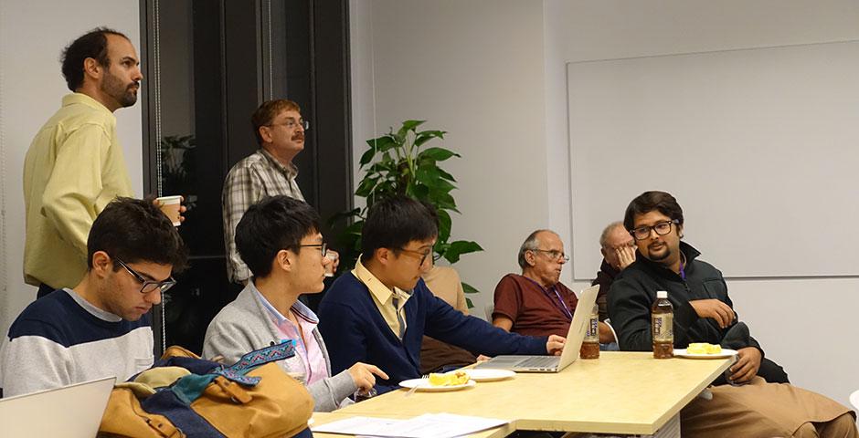 Professor Moshe Kim speaks on the relationship between economics and mathematics. November 24, 2014. (Photo by Yilun Yan)