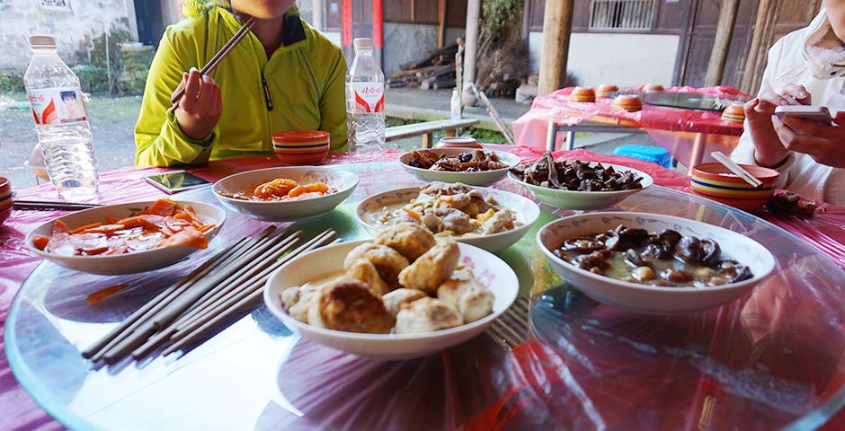 We were treated to three deliciously homemade meals a day. Every meal was served family style, very typical of traditional Chinese food. Every meal was different every day but the most popular ingredient was bamboo because of the rich abundance of bamboo in the forest. When we would set out for our hikes in the morning, our local guide would stop along the way to dig up the bamboo shoots we would later enjoy for lunch and dinner.  (Photo by: Annie Seaman)