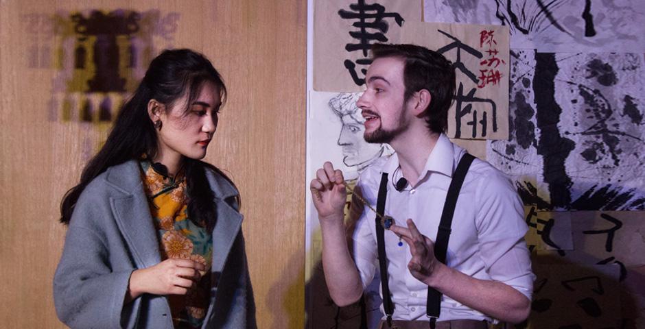Lauren Benedict ‘21 directed a cast of 14. In this scene, Victor, played by Ethan Slater ‘22, explains to his girlfriend Mei, played by Ouyang Yifan ‘22, the significance of a necklace to the murder mystery. [Photo by Kyle Maloney ‘21]
