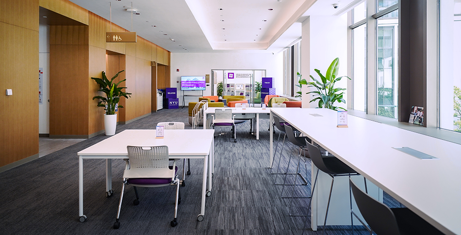 Graduate Lounge, located outside Room S201, New Bund Campus. The Graduate Lounge forms a hub for graduate student life at NYU Shanghai. It is a place to study, meet other graduate students, relax between classes and attend graduate student events. The space includes an open-plan group study area, individual desks, lounging areas, and printing equipment.