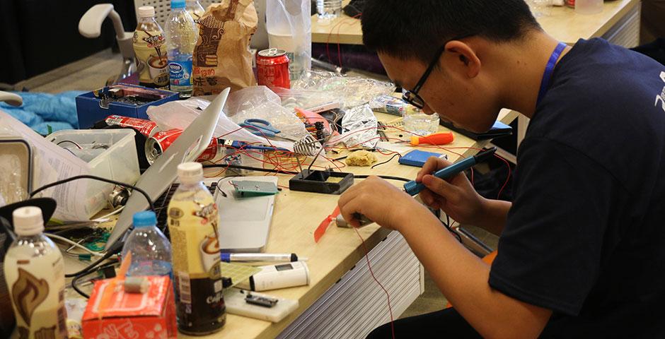 250 of the world's top student programmers competed in HackShanghai, a 24-hour coding marathon. November 15-16, 2014. (Photo by Kadallah Burrowes)