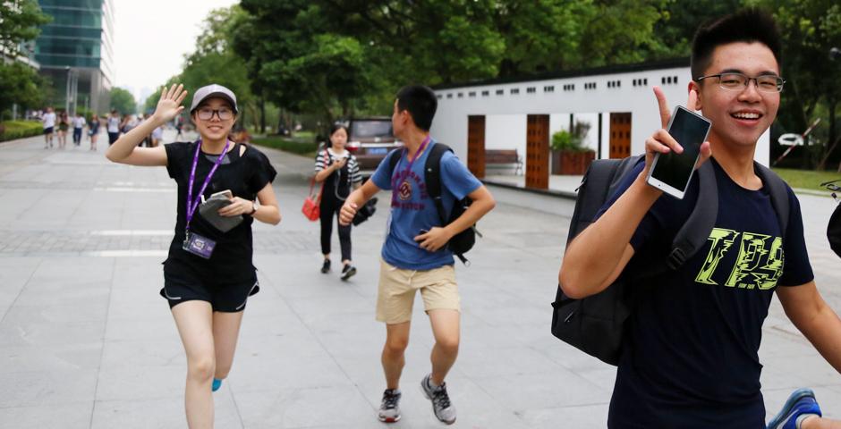 And they&#039;re off! Freshmen students get a running start on the Amazing Race, as they scatter all over Shanghai to compete at solving puzzles and completing photo challenges around The Bund, Jing’an Temple, Century Park, 1933 Shanghai, and the Former French Concession. (Photo by: NYU Shanghai)