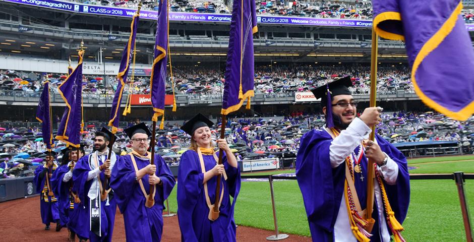 The 186th All-University Commencement Exercises opened with the academic procession around Yankee Stadium, led by representatives of each faculty. ( Photo by: Leo Sorel )