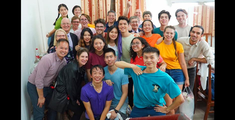 Bravo! Cast members celebrate a successful show backstage with NYU President Andrew Hamilton and his wife Jenny, Chancellor Yu Lizhong, and Vice Chancellor Jeff Lehman.