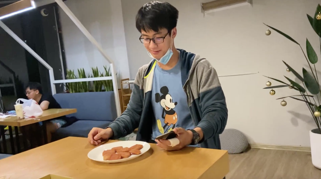 Lunchmeat:  Despite a scrapped story line and a lunchmeat-cutting mishap that sent him briefly to the hospital (note the bandage on his finger), Steven Sun NYU ’24 and his teammates successfully met the One in 24 challenge with a story based on a real-life relationship snafu. “This film is a black comedy. We build up an intense mission in the beginning, … and when we actually reach the end, we only get an emoji of question marks,” Sun said. “Suddenly all the tension and seriousness built up before falls apart.”