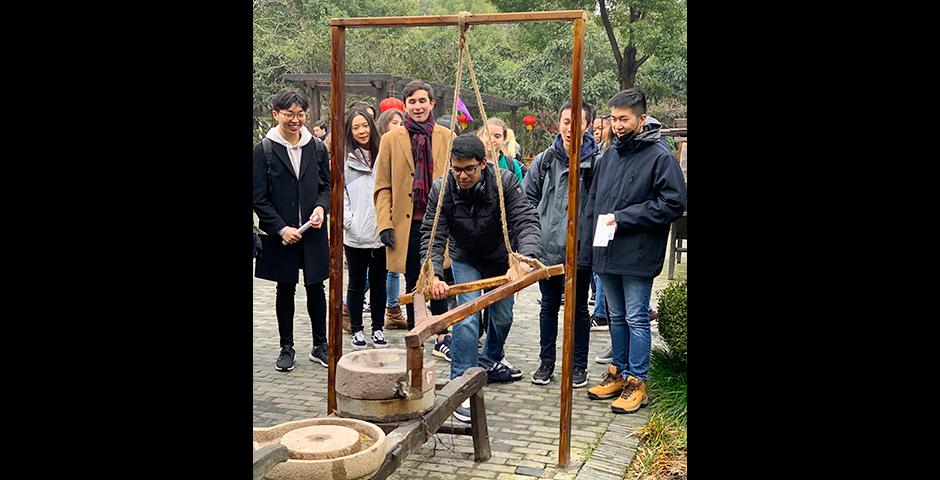 Study Away Cultural Excursion - Learning how to use Chinese stone mill at Zhujiajiao Watertown