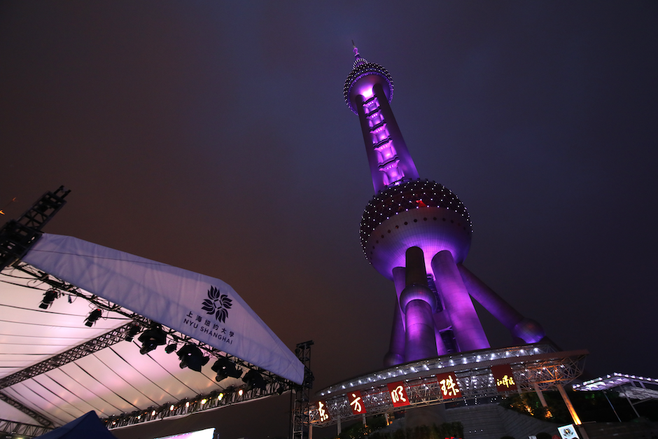 May 22:  The Oriental Pearl Tower shines violet for NYU Shanghai’s graduating Class of 2018.