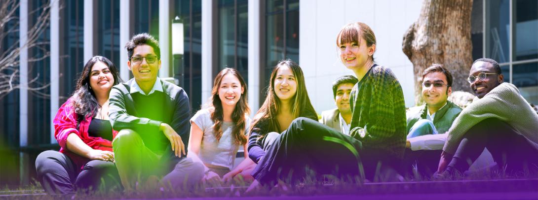 NYU Shanghai students sitting on the lawn in the courtyard at the New Bund Campus