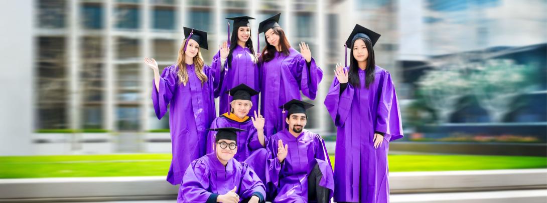 graduates in their caps and gowns on the quad