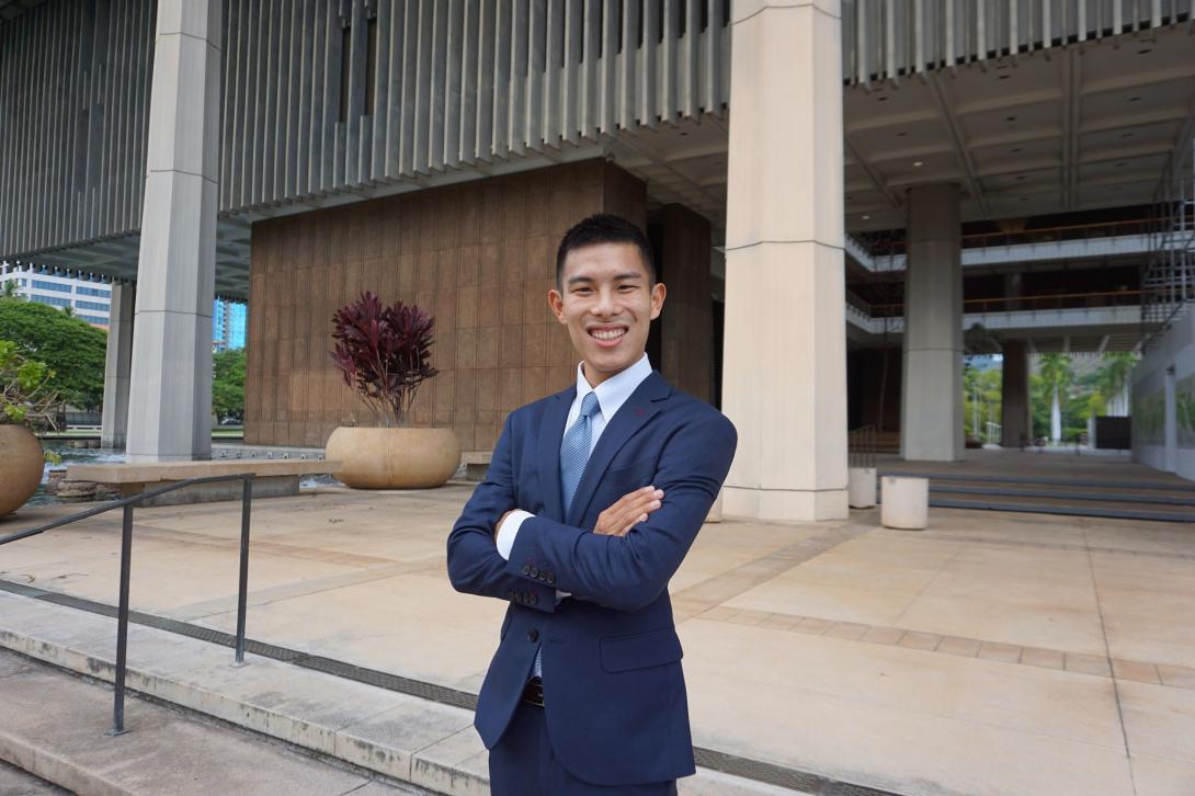 Sayama, standing in front of the Hawaii State Capitol